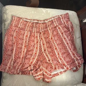 red, orange, and white flowy shorts that can be dressed up or down. *has pockets